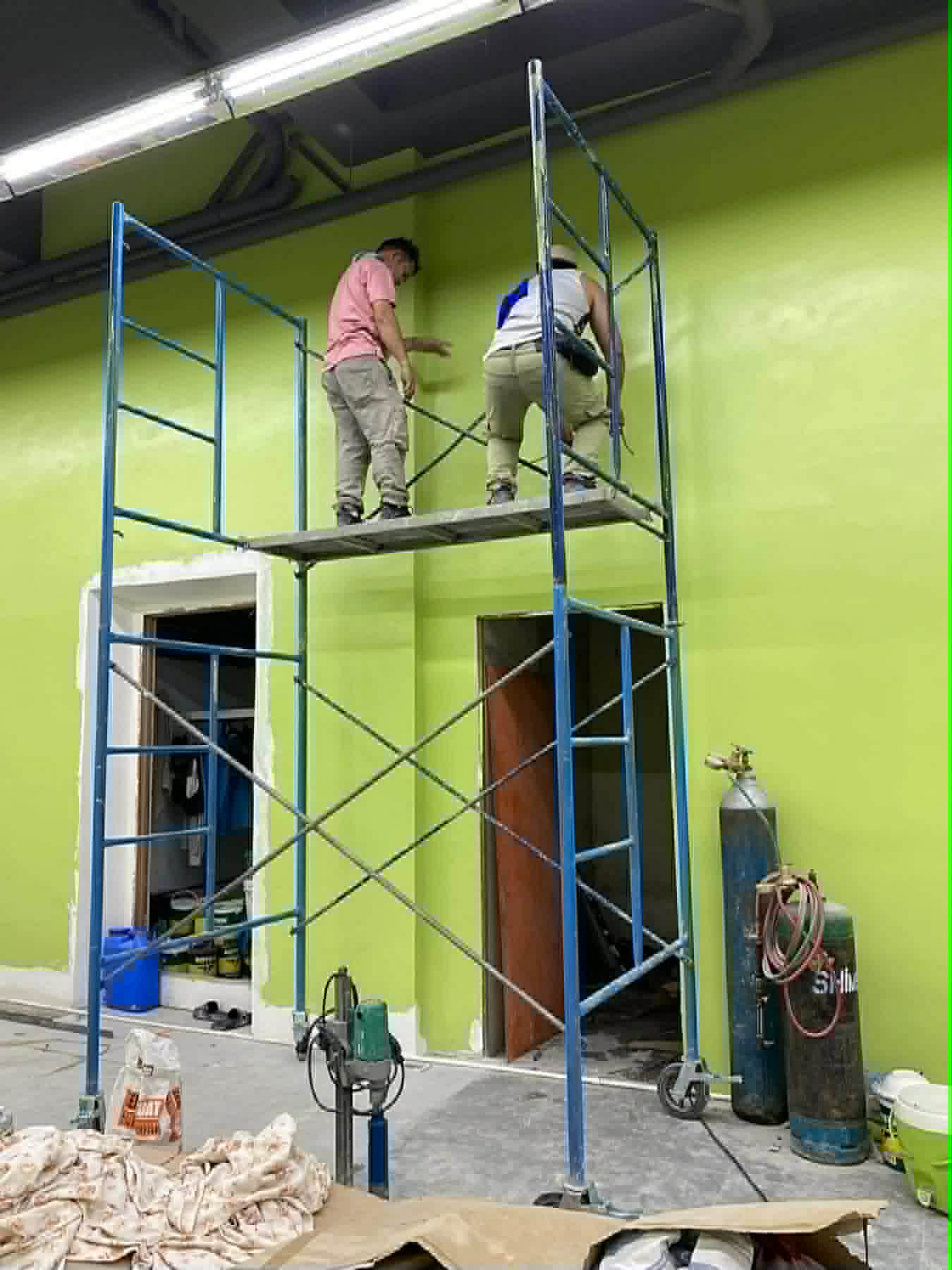 Commercial HVAC installation on scaffold